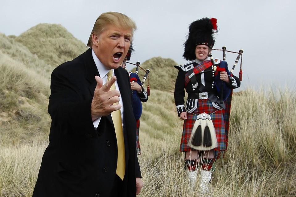 U.S. property mogul Donald Trump gestures during a media event on the sand dunes of the Menie estate, the site for Trump's proposed golf resort, near Aberdeen, north east Scotland May 27, 2010. REUTERS/David Moir (BRITAIN POLITICS - Tags: SPORT GOLF BUSINESS) - RTR2EFTU
